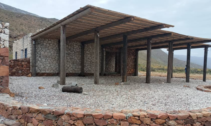 Traditional house in Rosh, Socotra, showcasing local architecture surrounded by the island's unique landscape.